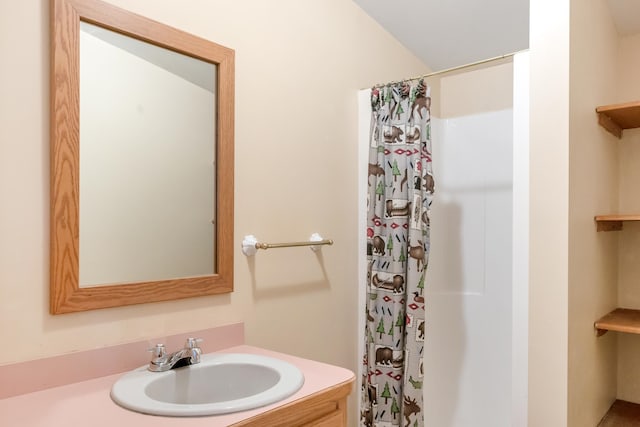 bathroom with vanity and a shower with curtain