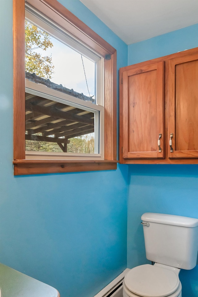 bathroom with toilet and plenty of natural light