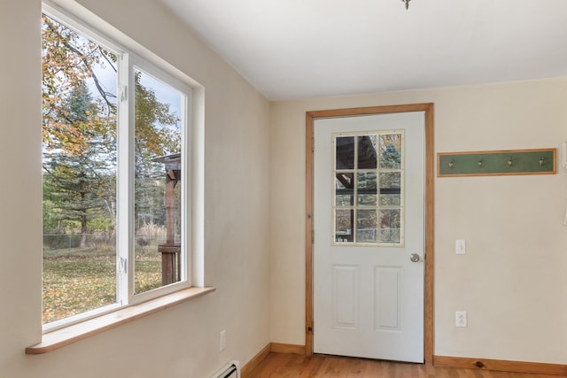 entryway with light hardwood / wood-style floors and a wealth of natural light