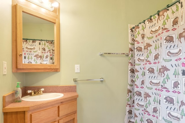 bathroom with vanity and a shower with shower curtain