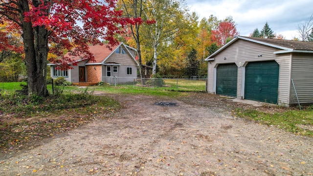 exterior space featuring an outdoor structure and a garage