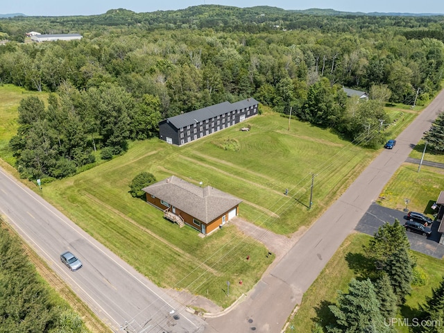 birds eye view of property with a rural view