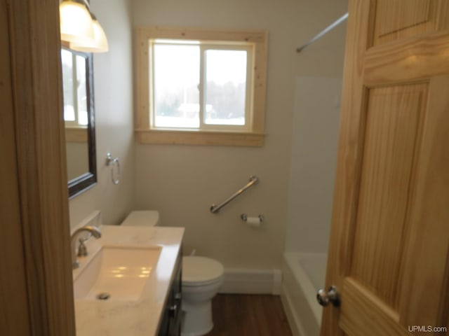 full bathroom featuring vanity, toilet, bathing tub / shower combination, and wood-type flooring