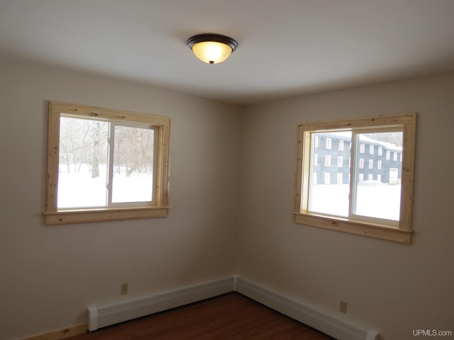 empty room with dark hardwood / wood-style floors