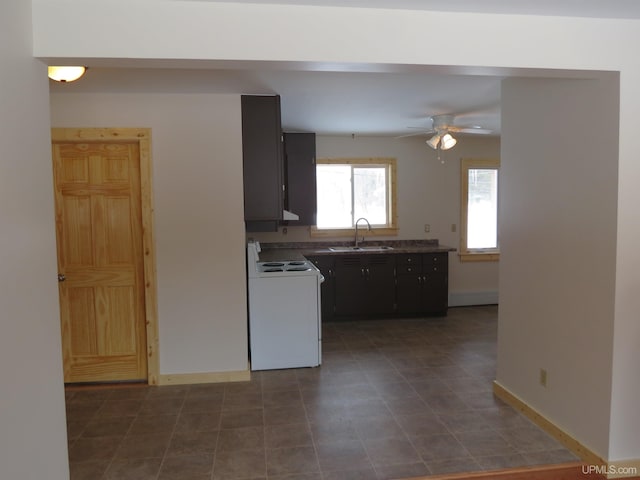 kitchen with sink, ceiling fan, extractor fan, and electric stove