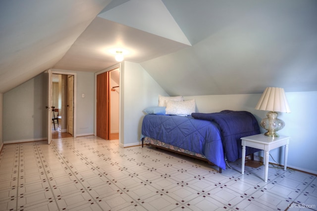 bedroom featuring lofted ceiling