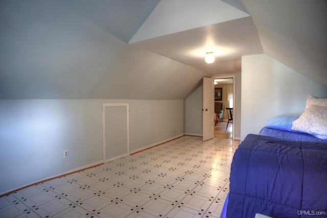 bedroom featuring vaulted ceiling