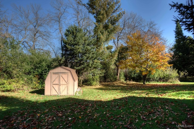 view of outbuilding with a lawn