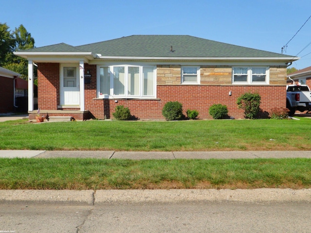 view of front of property with a front lawn