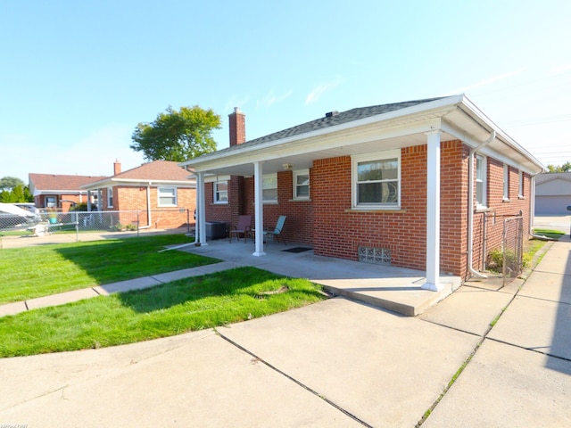 view of front of house featuring a garage and a front lawn