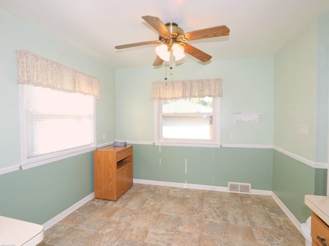 spare room featuring ceiling fan