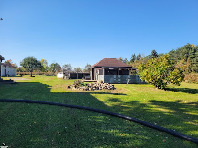 view of yard with a shed and a gazebo