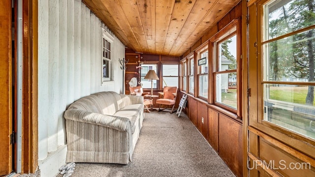 sunroom featuring lofted ceiling and wood ceiling