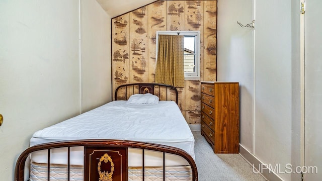 bedroom with vaulted ceiling