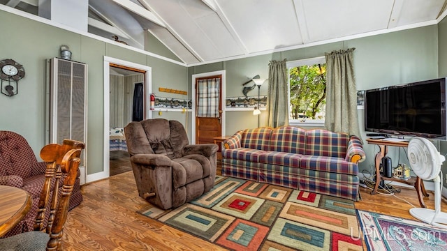 living room featuring wood-type flooring and vaulted ceiling