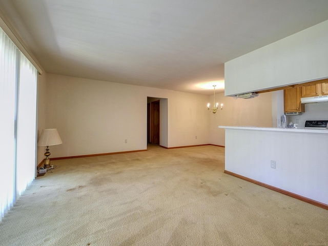 unfurnished living room with a chandelier and light colored carpet