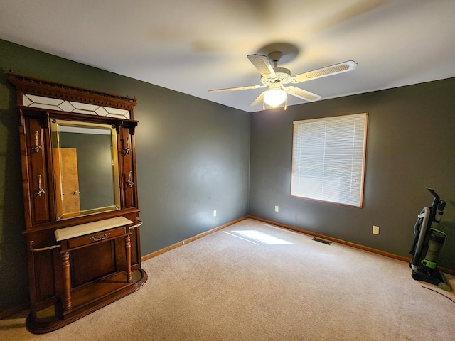 5206 Wolf Ln, Farwell, MI 48622 - unfurnished bedroom with carpet, baseboards, and ceiling fan