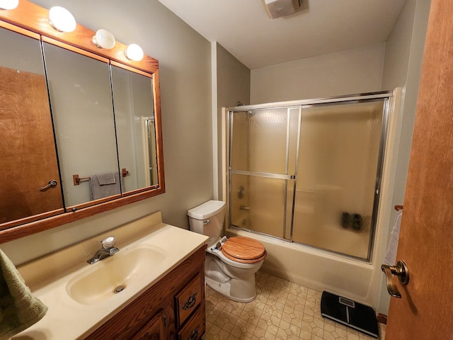 5206 Wolf Ln, Farwell, MI 48622 - bathroom featuring toilet, vanity, and shower / bath combination with glass door
