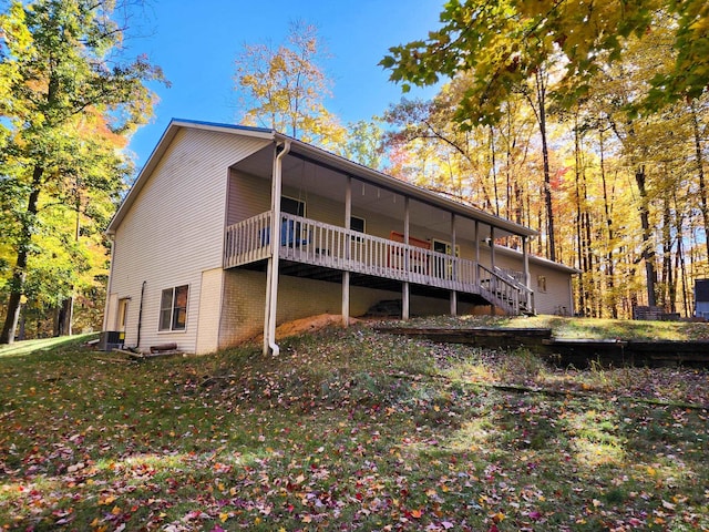 back of house with a wooden deck