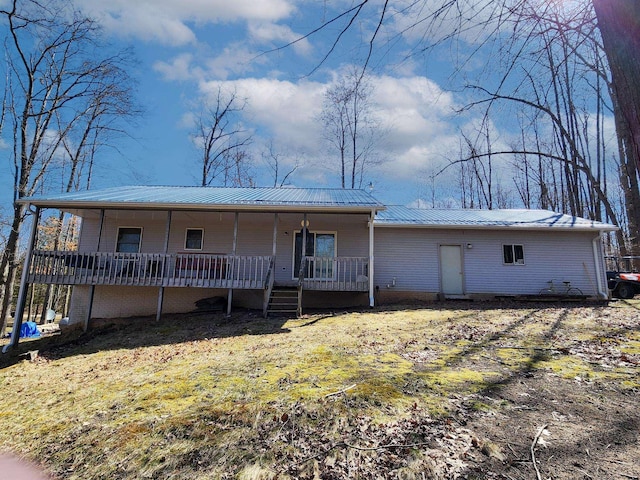 5206 Wolf Ln, Farwell, MI 48622 - view of front facade featuring a porch and metal roof