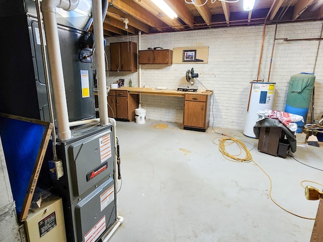 basement with water heater, a workshop area, brick wall, and heating unit