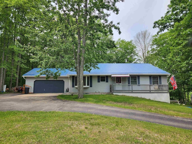 5206 Wolf Ln, Farwell, MI 48622 - single story home featuring a garage, driveway, a front yard, and metal roof