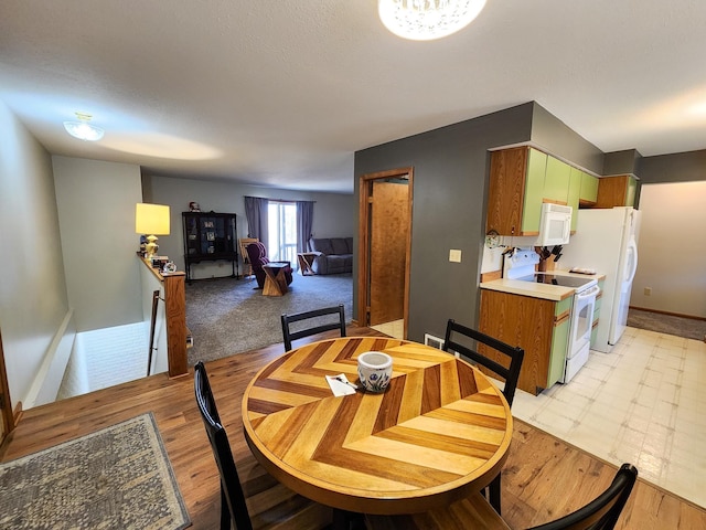 5206 Wolf Ln, Farwell, MI 48622 - dining room with baseboards and light wood finished floors