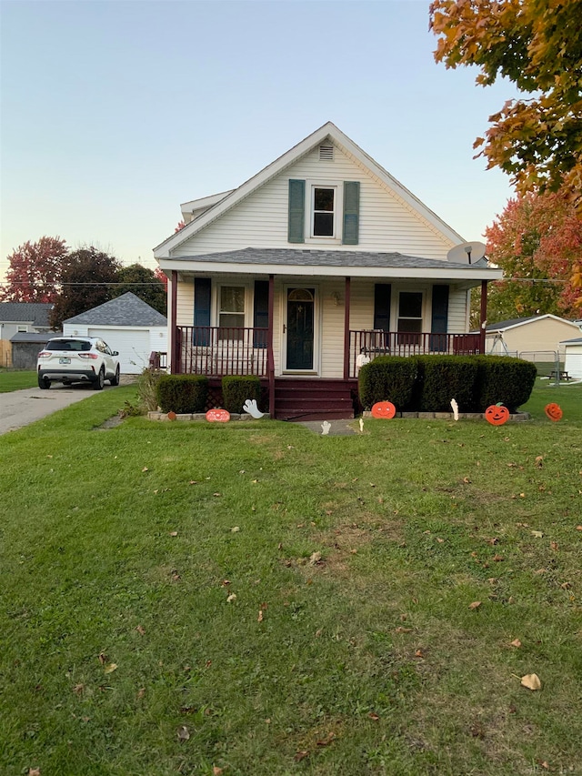 view of front of home with a porch and a front yard