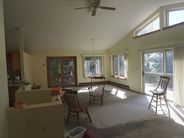 interior space featuring a baseboard heating unit, high vaulted ceiling, and ceiling fan