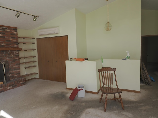 interior space featuring light carpet, a wall mounted AC, a brick fireplace, and rail lighting