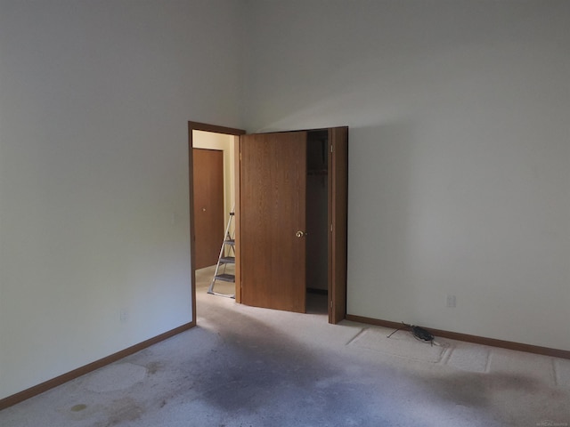 empty room with light colored carpet