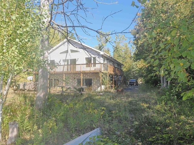 view of yard with a wooden deck