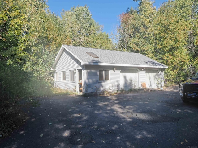 view of property exterior featuring a garage