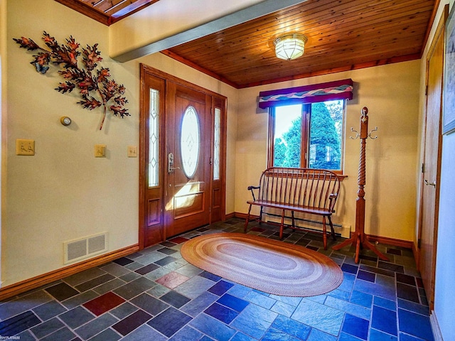 foyer featuring wooden ceiling and a baseboard heating unit