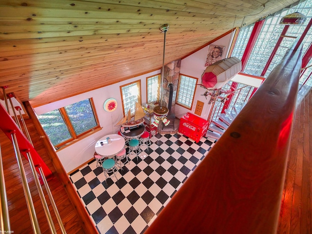 living room featuring lofted ceiling, hardwood / wood-style flooring, and wooden ceiling