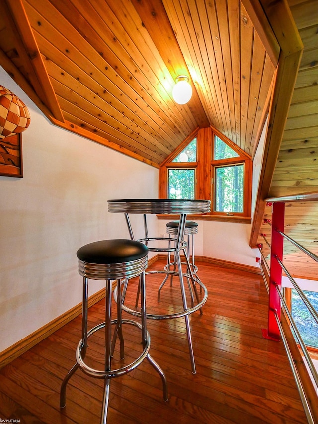 interior space featuring wooden ceiling, vaulted ceiling, and hardwood / wood-style flooring