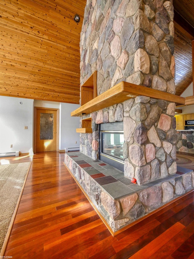 unfurnished living room with hardwood / wood-style floors, a stone fireplace, high vaulted ceiling, and a baseboard radiator