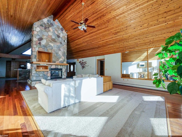 living room featuring a stone fireplace, ceiling fan, wood-type flooring, and wooden ceiling