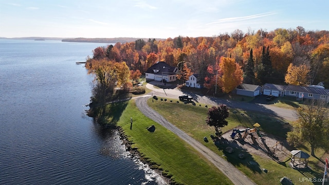 birds eye view of property with a water view