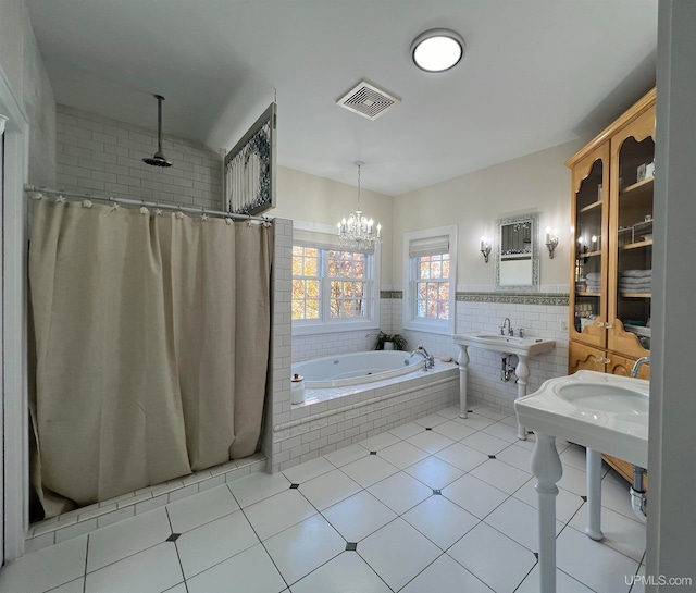 bathroom with tile walls, tile patterned floors, a chandelier, and plus walk in shower