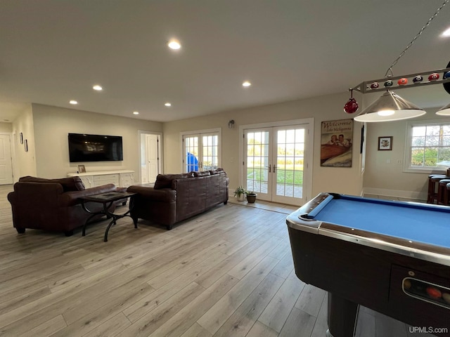 game room with light hardwood / wood-style floors, french doors, and pool table