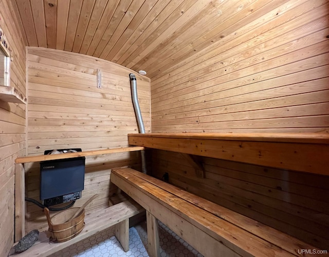 view of sauna with wood ceiling and wood walls