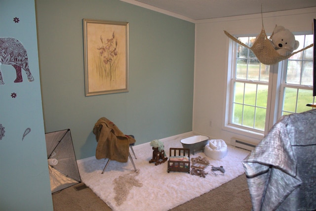 interior space with ornamental molding, carpet floors, and a baseboard radiator