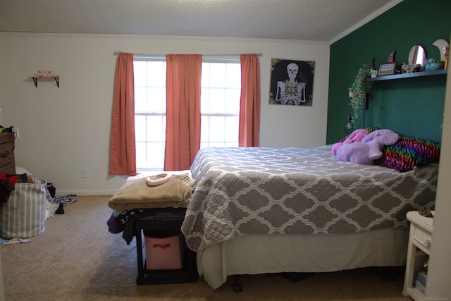 bedroom with carpet, crown molding, and a textured ceiling