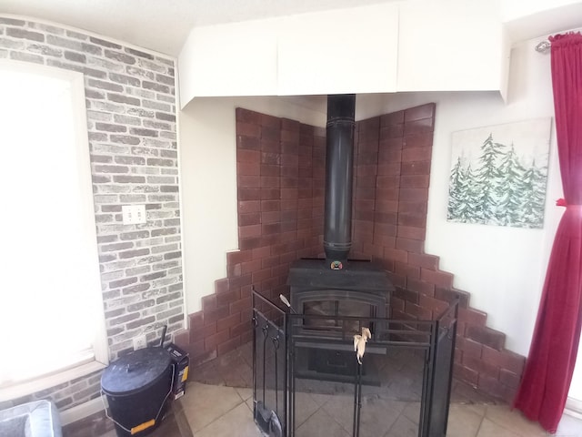 room details featuring tile patterned floors and a wood stove