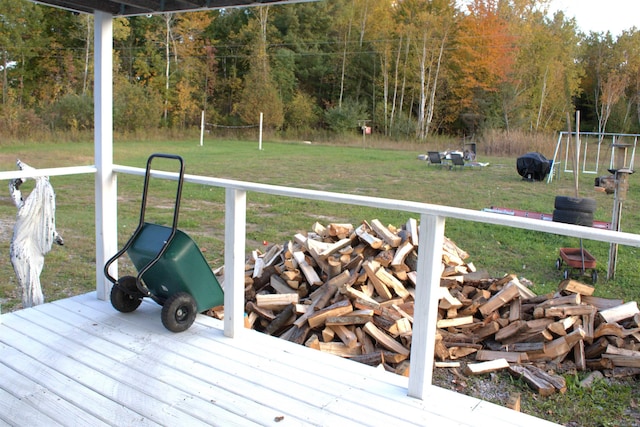 deck featuring a fire pit and a yard