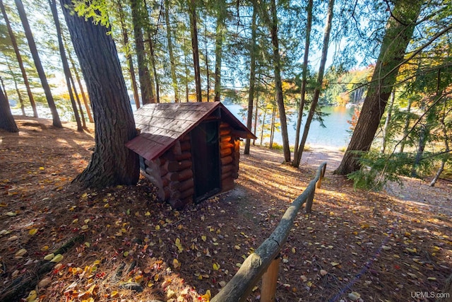 view of outbuilding with a water view