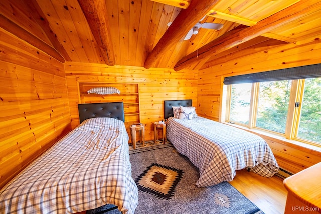 bedroom with wood ceiling, hardwood / wood-style floors, vaulted ceiling with beams, and wood walls