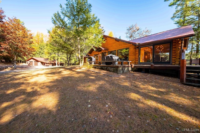 exterior space with a deck and a carport