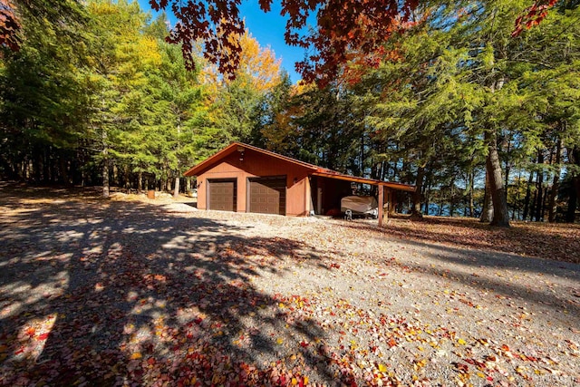 exterior space featuring an outdoor structure and a garage